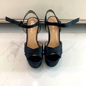 Satin cross strap platforms black.